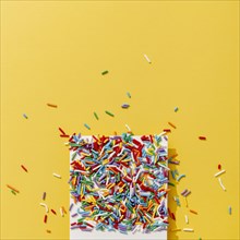 Top view colorful sprinkles with copy space