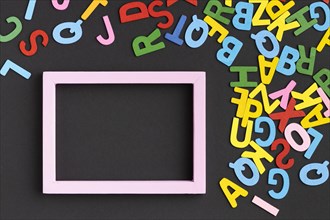 Flat lay frame with colorful letters