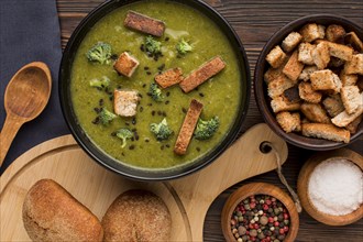 Top view bowl with winter broccoli soup croutons