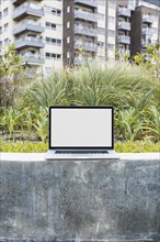 Laptop retaining wall front apartment