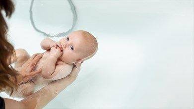 Close up woman washing baby