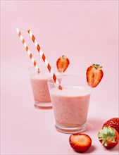 Strawberry smoothies with pink background