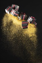 Arrangement black friday gifts with golden glitter