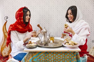 Muslim women drinking tea