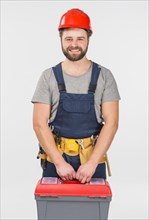 Repairman overall with tool box smiling