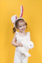 Cute girl bunny ears with rabbit