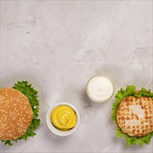 Top view burgers with mayo mustard dip