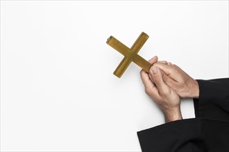 Priest holding holy cross hands