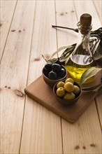 Close up bottle olive oil olives