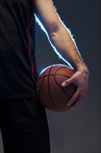 Front view basketball player with ball hand