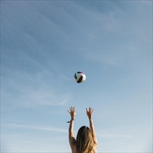 Woman playing volleyball beach