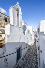 Small white church and Cycladic houses