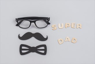 Super dad inscription with glasses paper mustache
