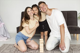 Beautiful family laying floor game