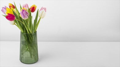 Vase with tulips copy space