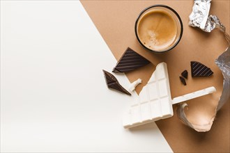 White dark chocolate bar with coffee glass dual background