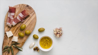Infused olive oil olives garlic club cheese bacon isolated white backdrop