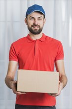 Positive man delivering parcel