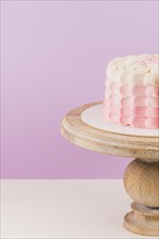 Close up birthday cake wooden cakestand