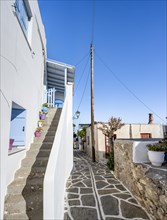 White Cycladic houses with blue shutters