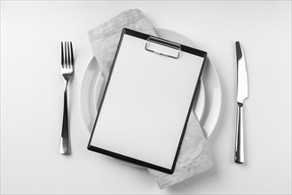 Top view empty menu plate with cutlery