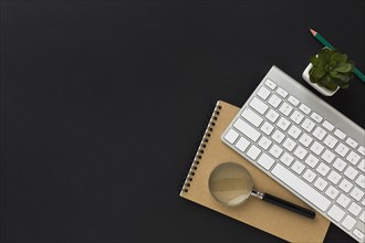 Flat lay work desktop with notebook keyboard