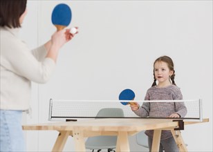 Mom child playing ping pong
