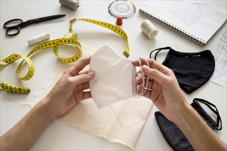 Woman holding face mask she sew