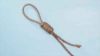 Brown solid rope with difficult knot