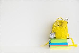 Creative workspace with yellow backpack notebooks