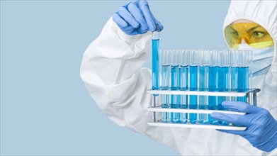 Scientist looking blue chemicals