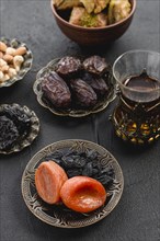 Turkish tea with dates dried apricot raisin arabian iron plate ramadan