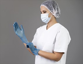 Medium shot woman wearing gloves