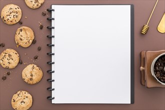 Flat lay blank menu notebook with cookies
