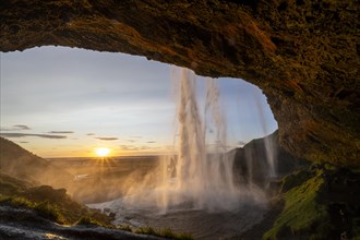 Seljalandsfoss waterfall at sunset