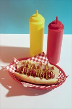 High angle arrangement with hot dog sauce bottles