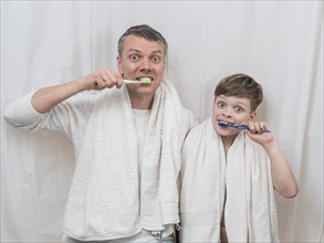 Father s day brushing teeth together
