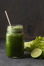Front view green healthy smoothie jar