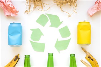 Paper recycle logo with colorful garbage