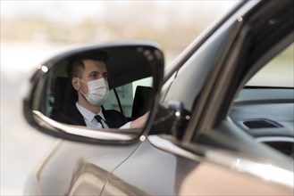 Man car mirror with mask