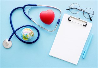 Flat lay notepad with heart shape stethoscope
