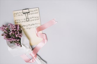 Flowers bouquet with music sheet light table