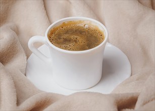 High angle morning coffee cup bed