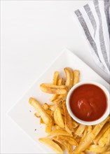 Top view french fries plate with ketchup copy space
