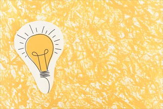 Hand drawn light bulb cut out yellow pattern background
