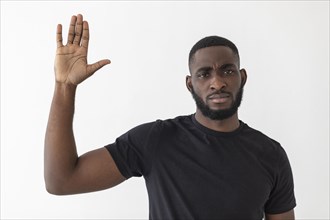 Black person waving with his hand