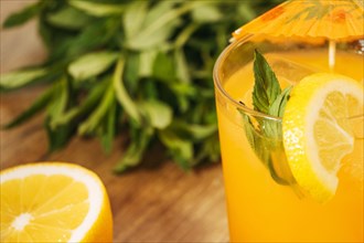 Orange drink with lemon slice