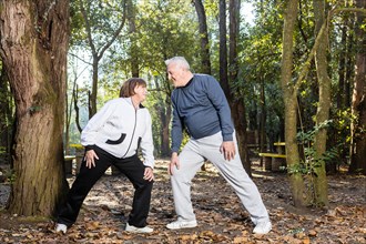 Senior couple doing warm up exercises together