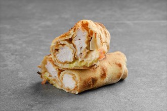 Chicken fillet rolled and baked in dough with cabbage