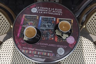 Two cups of coffee on a bistro table in a Paris cafe
